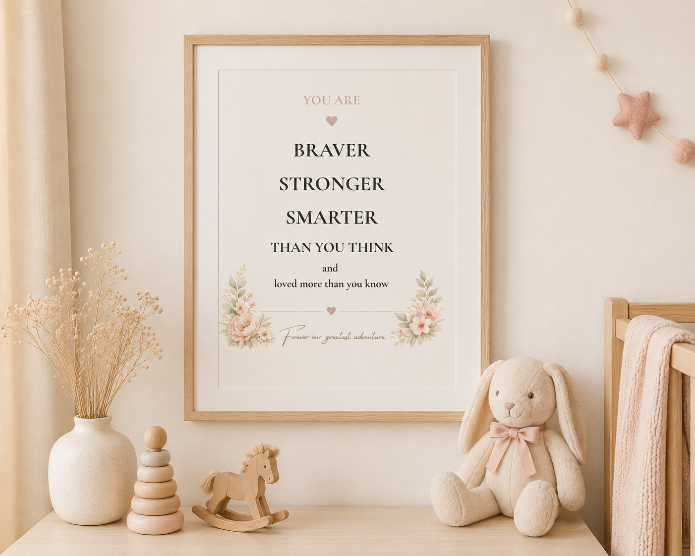 Framed motivational quote print in a neutral nursery with oak frame 