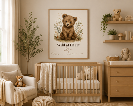 Watercolour woodland bear nursery print with the quote “Wild at Heart Little One” in a light oak frame displayed in a neutral nursery.
